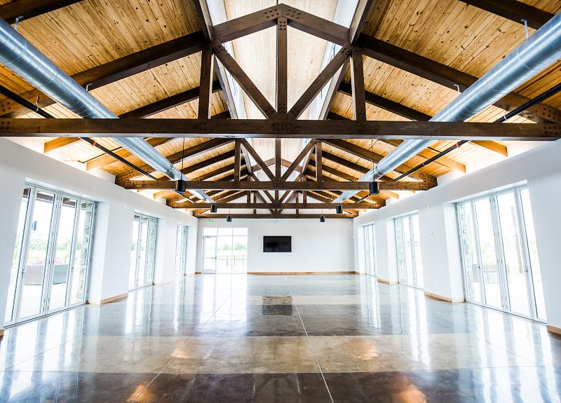 The Farmhouse Event Hall in Richmond, TX has removable windows, high ceilings.