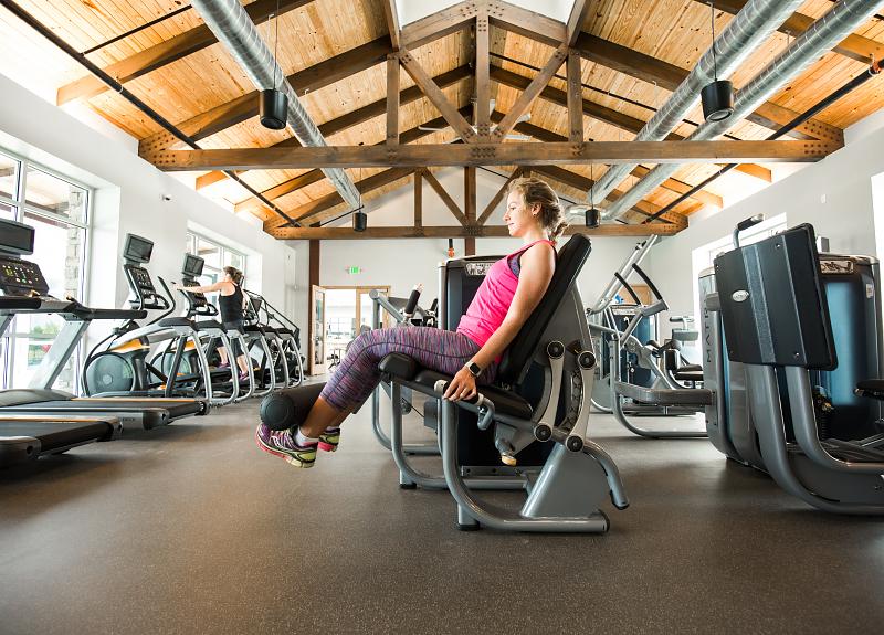 Harvest Green residents have access to strength training machines at The Farmhouse.