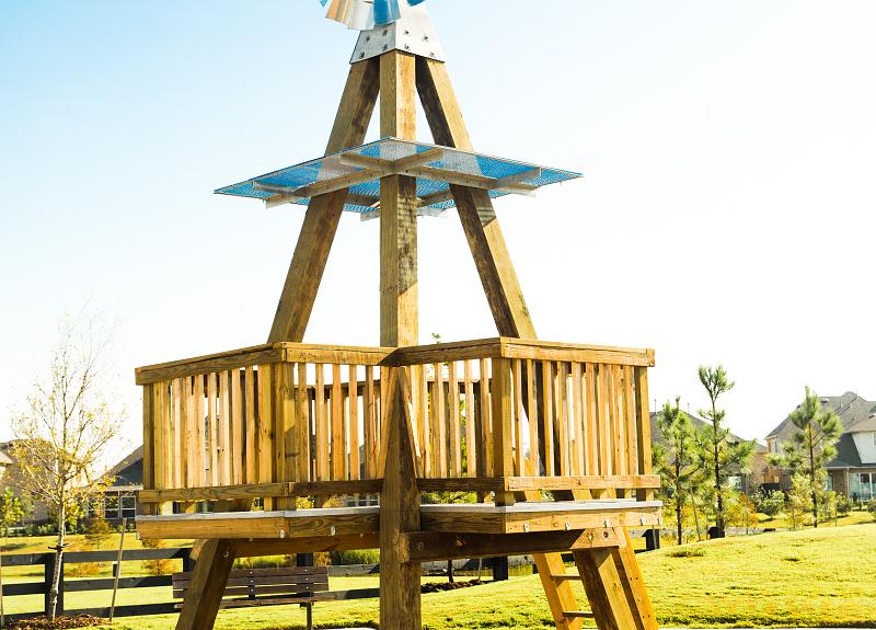 A tall wooden play structure in one of Harvest Green's three playgrounds.