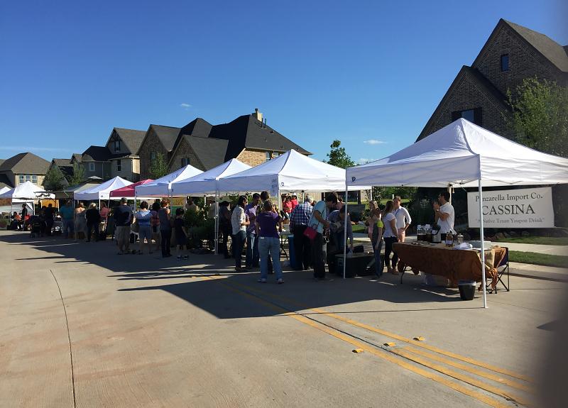 Crowds gather for goods from local vendors in Richmond, TX Farmers Market.