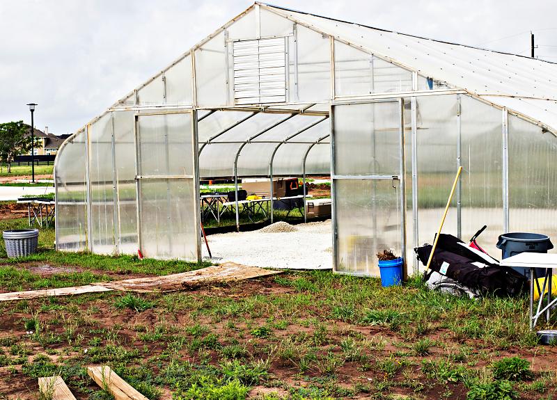 The Village Farm's greenhouse in Harvest Green, an agrihood in Richmond, TX.