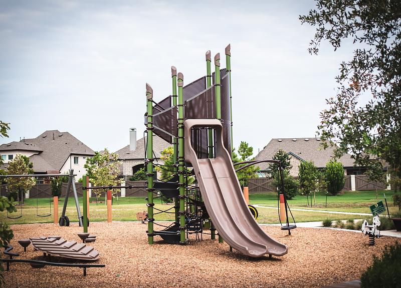 The kids will love the slide and equipment in Harvest Green's park.