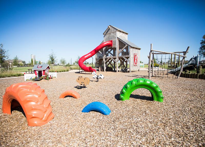 A playground in Richmond, TX in Harvest Green with colorful play structures