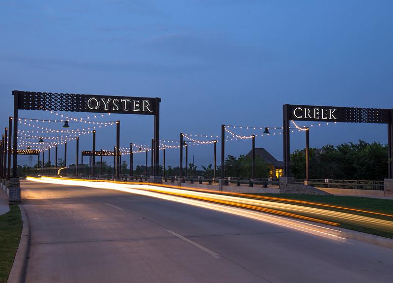 A night time shot of the Oyster Creek Bridge in Harvest Green.
