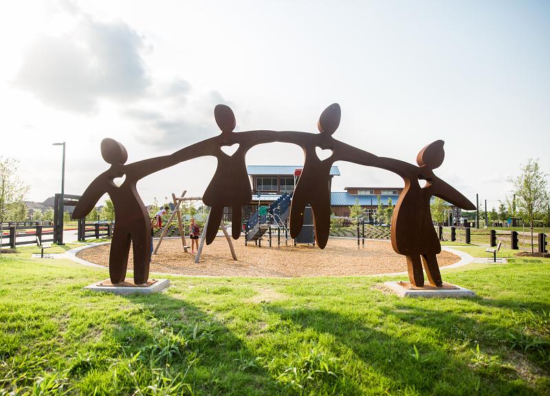 This community sculpture features children playing in Harvest Green in Richmond, TX.