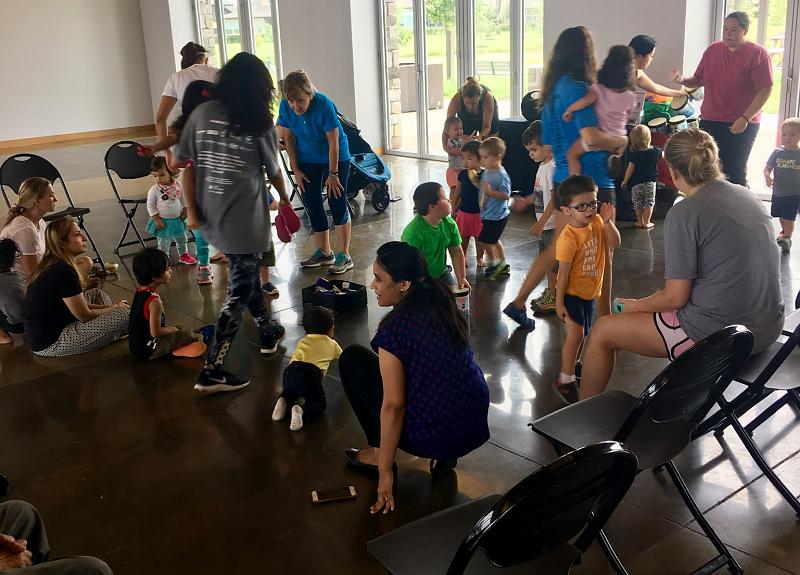 Family-friendly resident event in Harvest Green takes place in the fitness center.