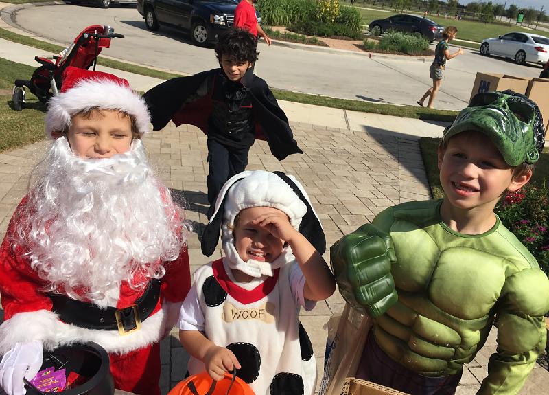 Kids in costumes for Harvest Green's trick-or-treat resident event for the community.