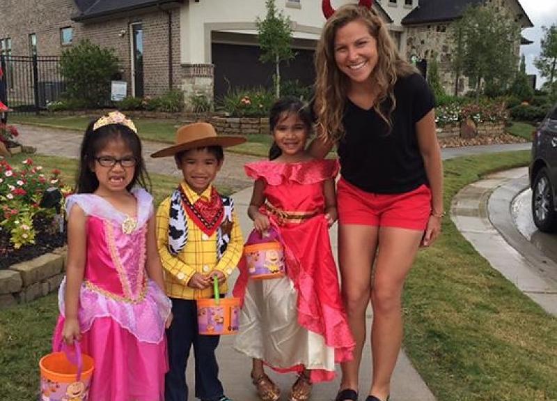 A resident family poses for a Halloween trick-or-treat event in Harvest Green.