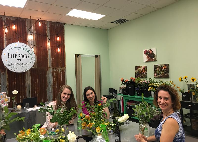 Harvest Green residents enjoy a resident flower arranging class in Fort Bend.