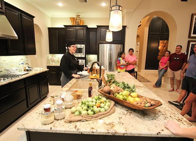 A Harvest Green resident event hosts a chef in a model home.